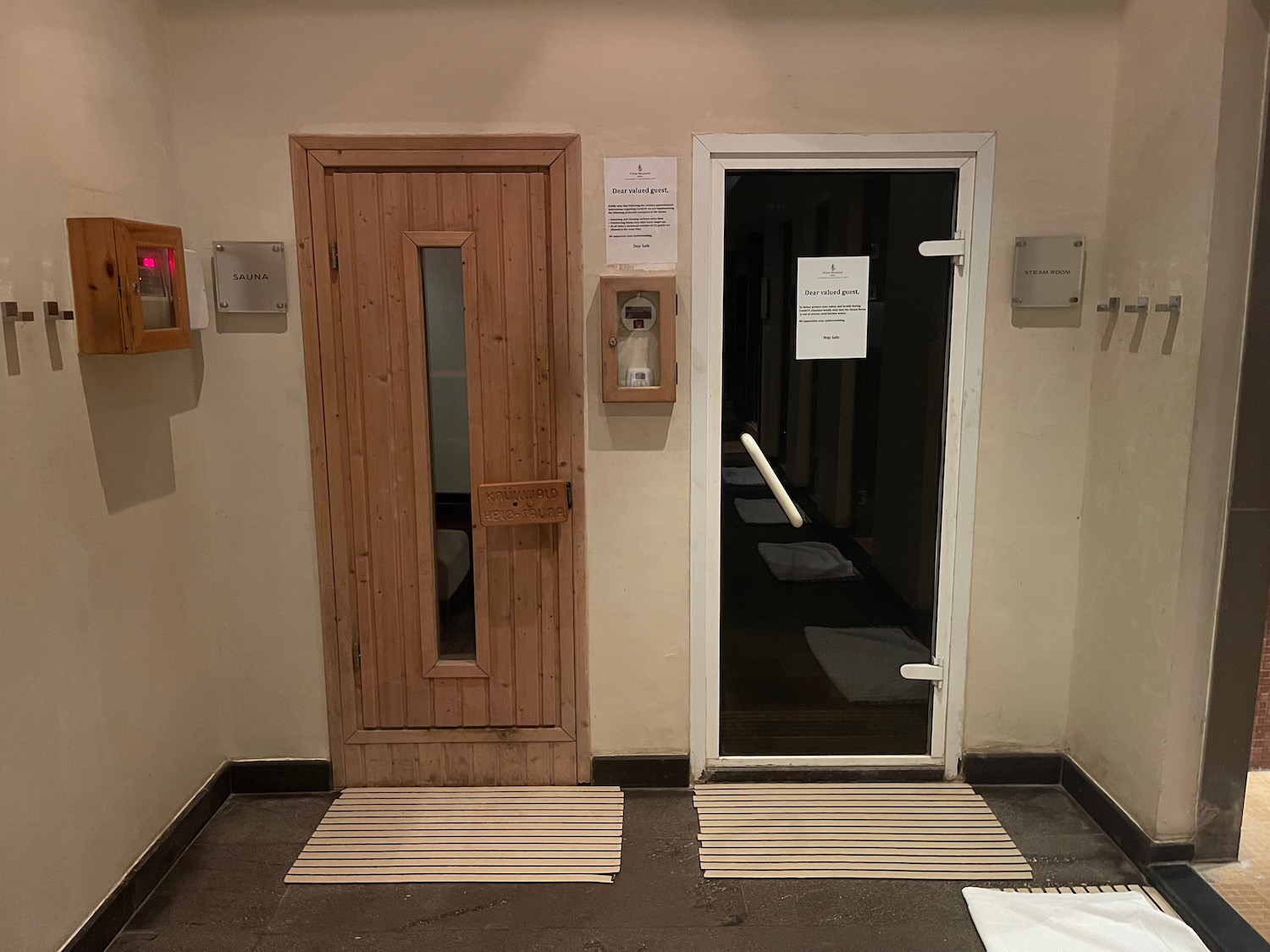 a door and a door with a sign on the wall