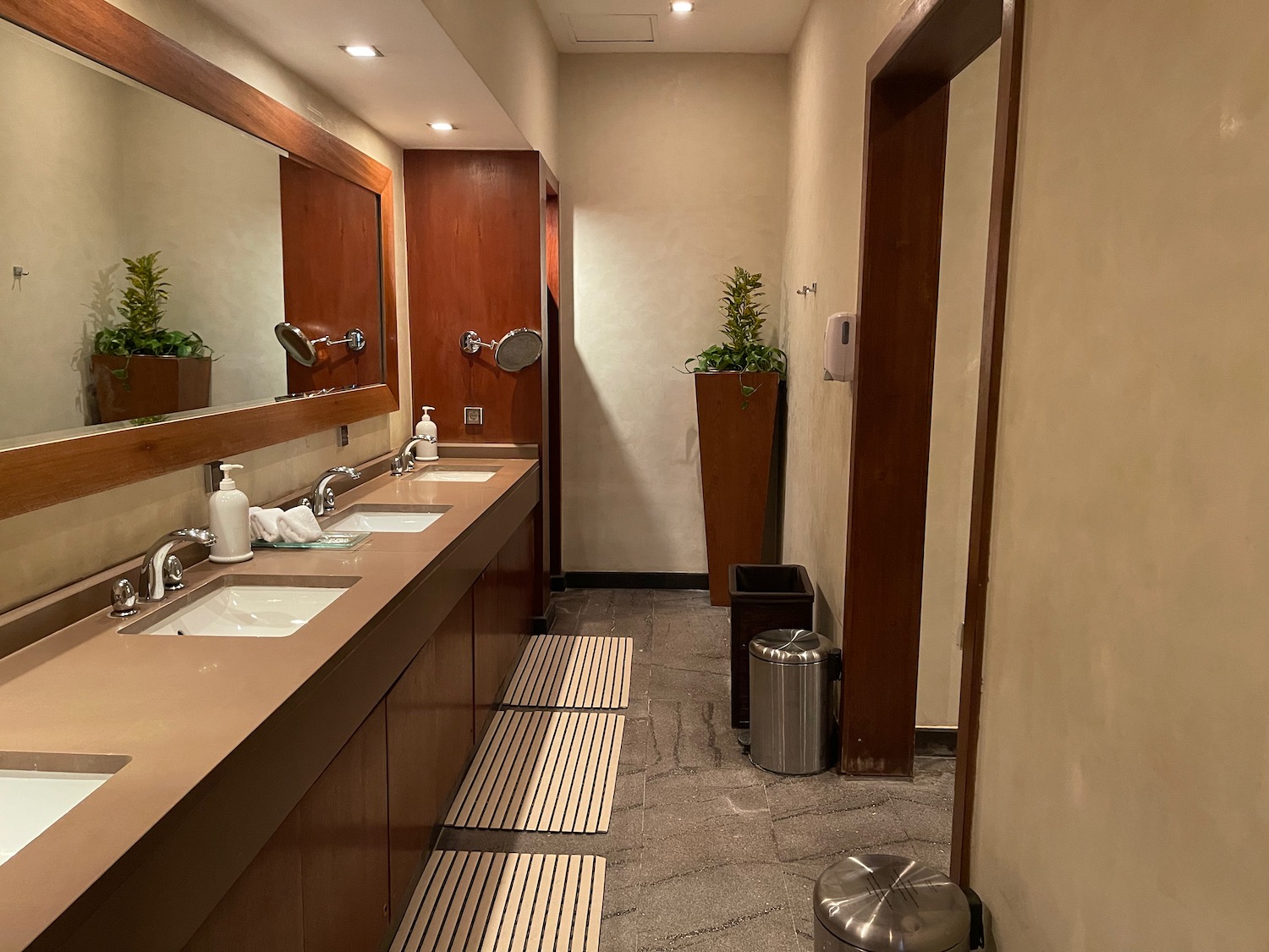 a bathroom with sinks and a mirror