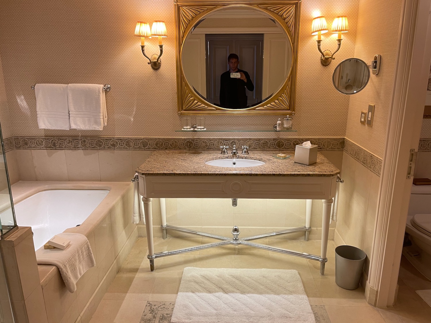 a bathroom with a mirror and bathtub