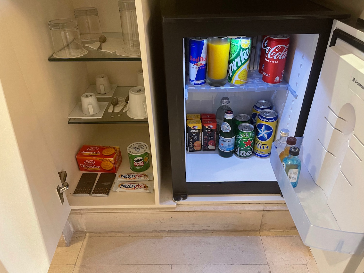 a small refrigerator with drinks and snacks