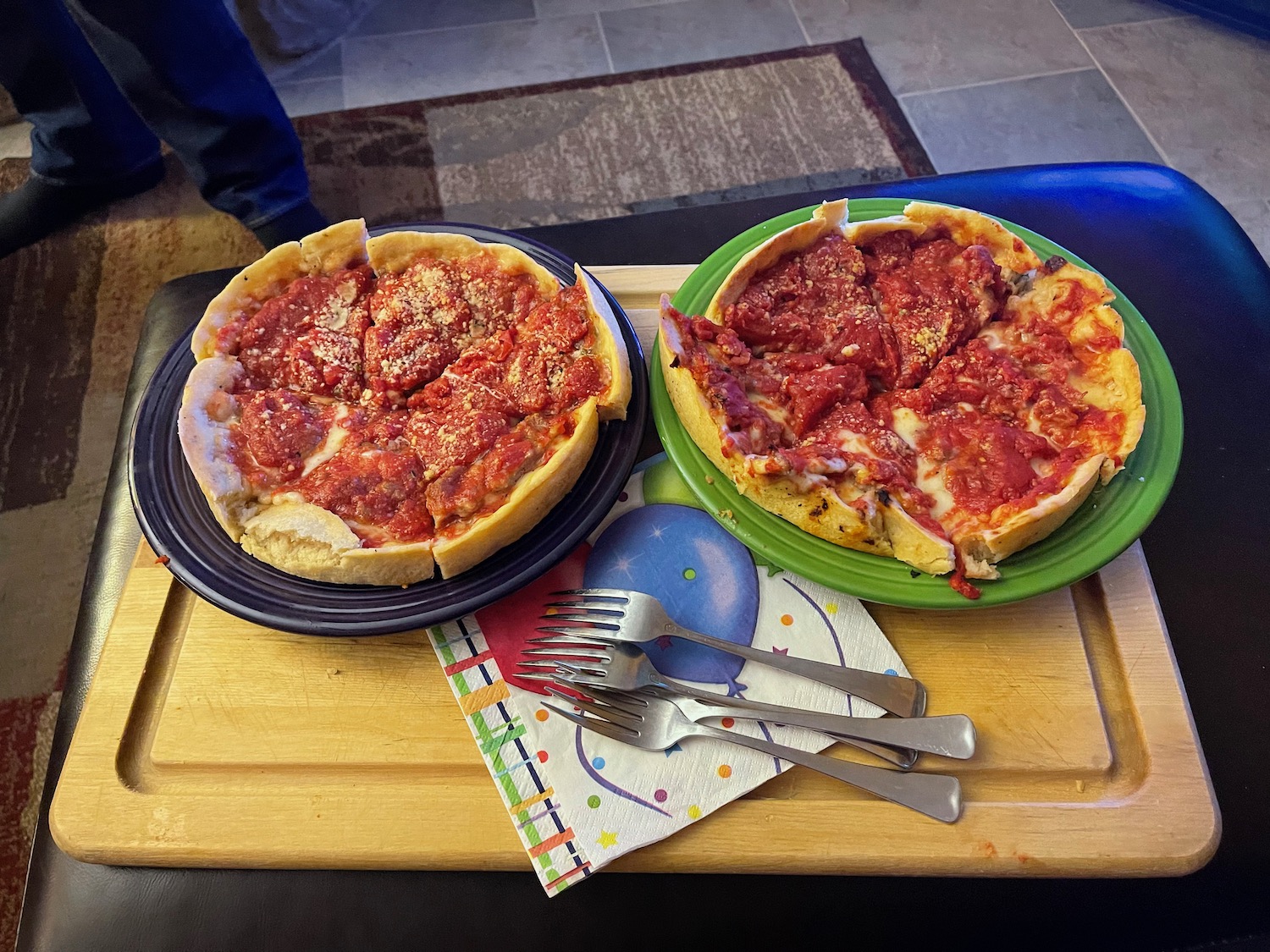 two plates of pizza on a tray