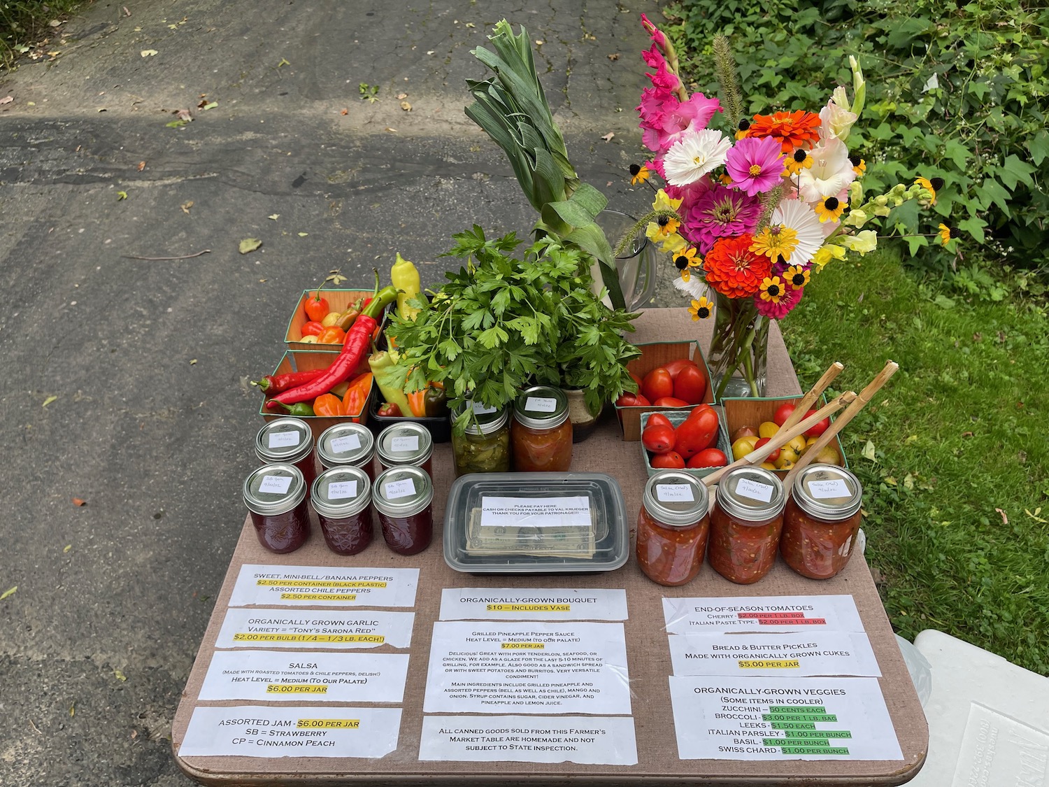 a table with jars of food and flowers