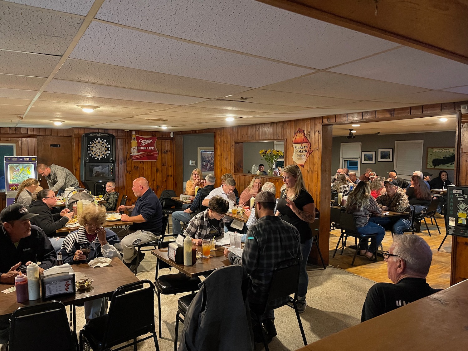 a group of people sitting at tables