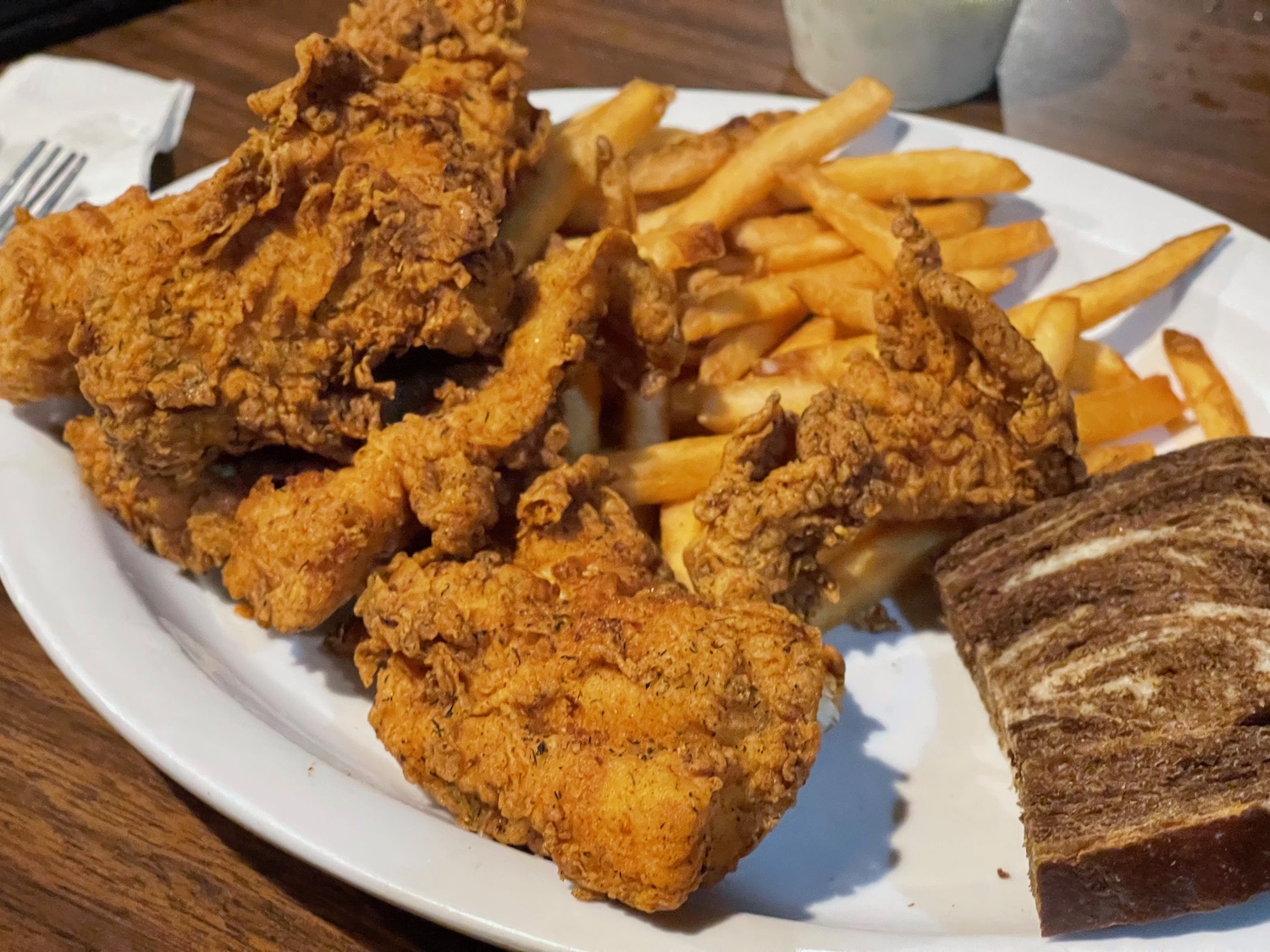a plate of fried chicken and fries