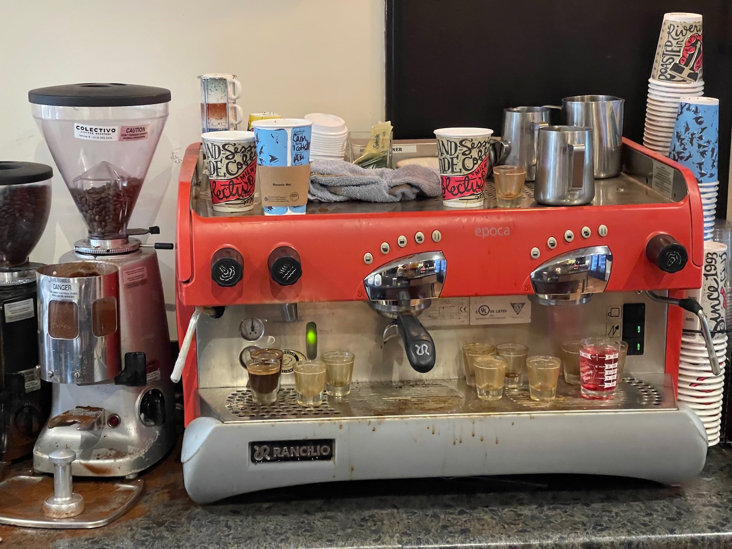 a coffee machine with cups on top