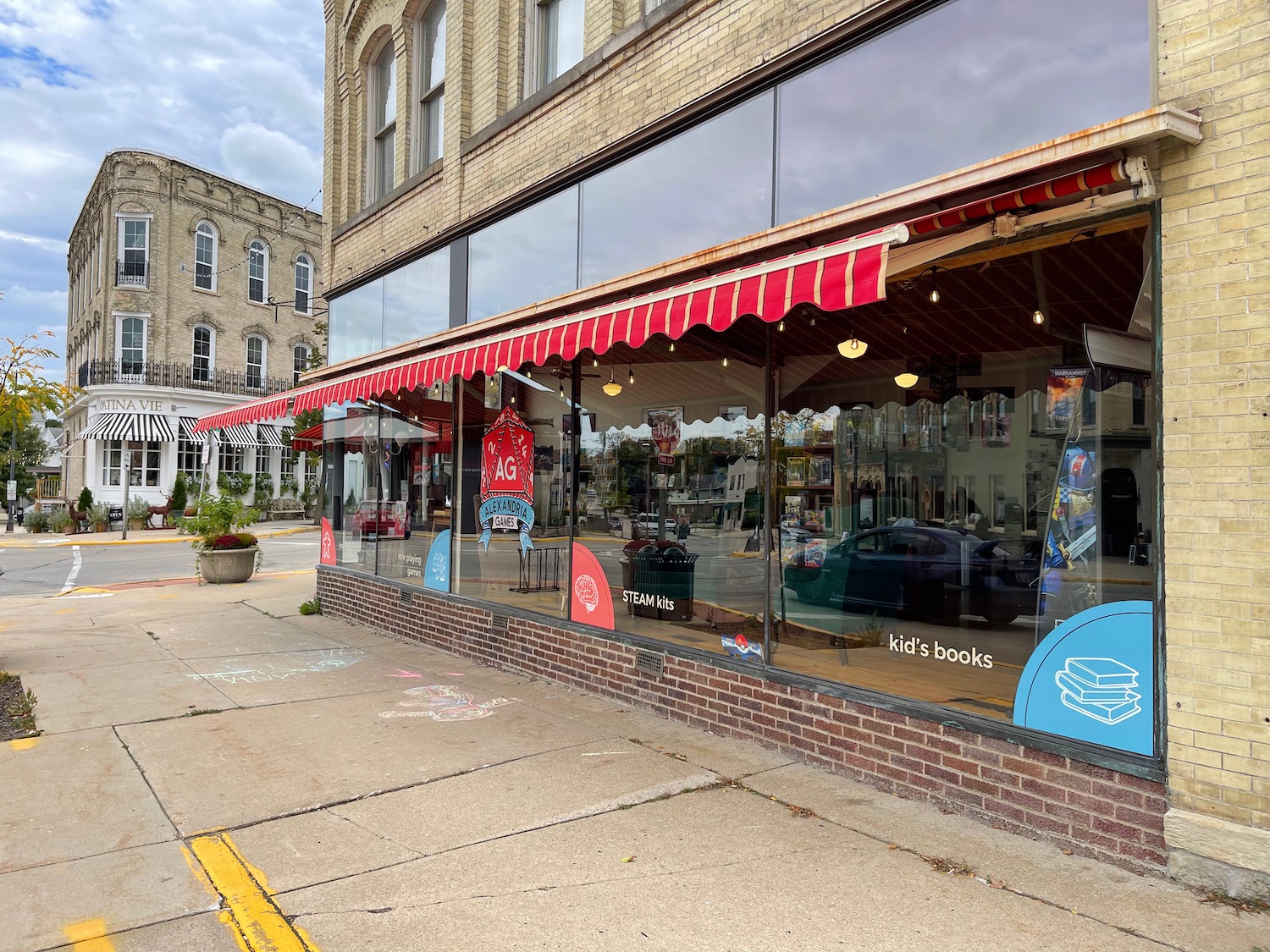 a storefront with a red awning