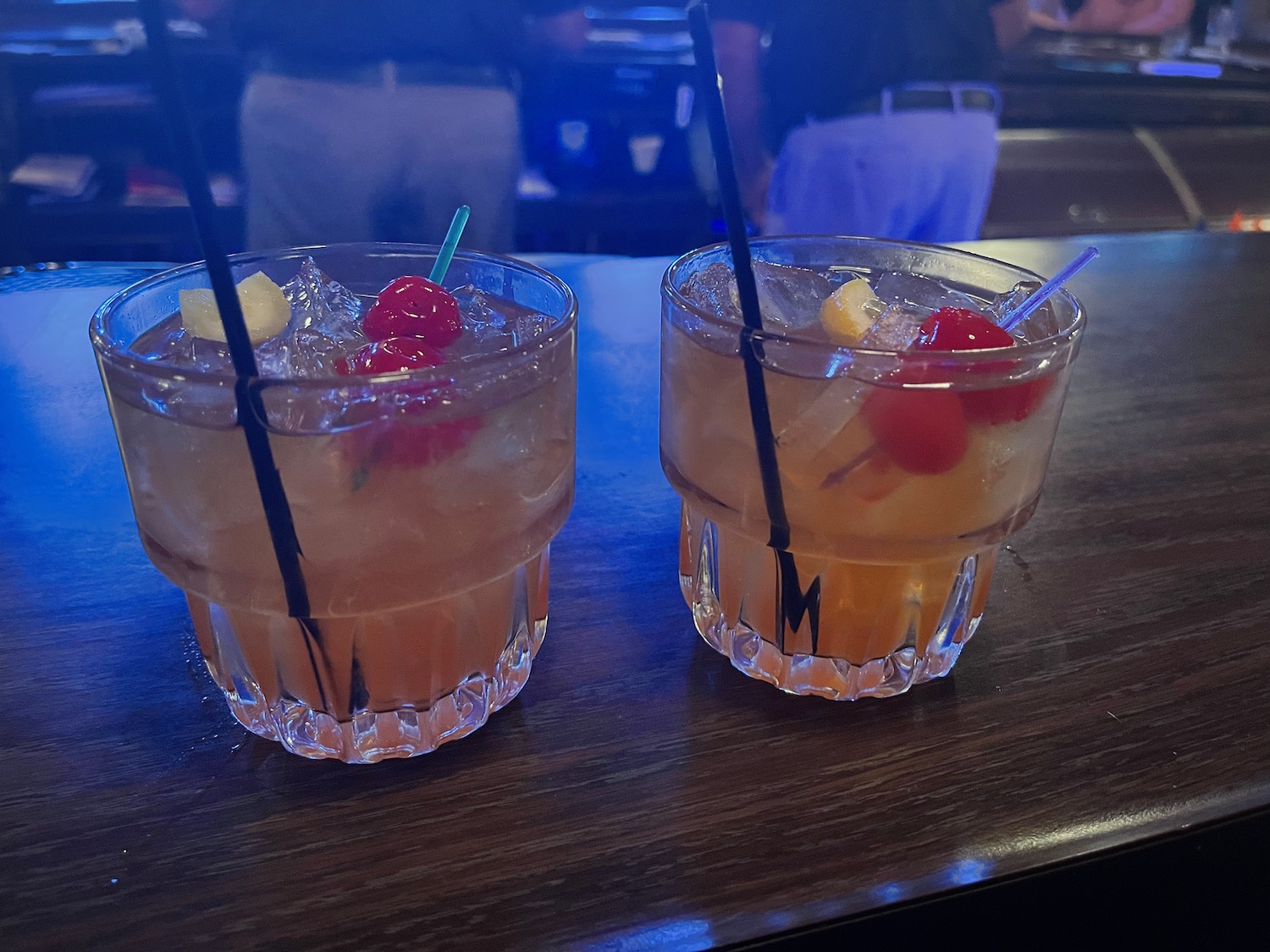 two glasses of drinks on a table