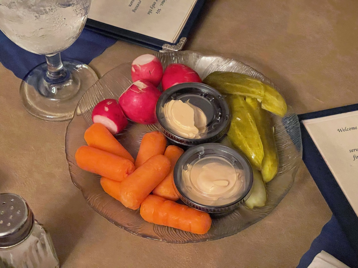 a plate of vegetables and dips