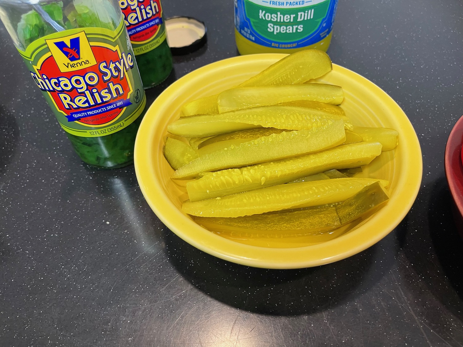 a bowl of pickles on a table