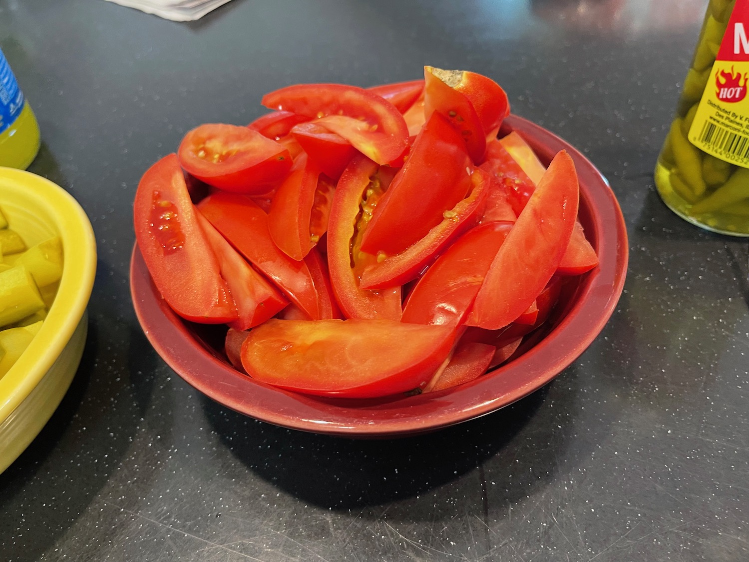 a bowl of sliced tomatoes