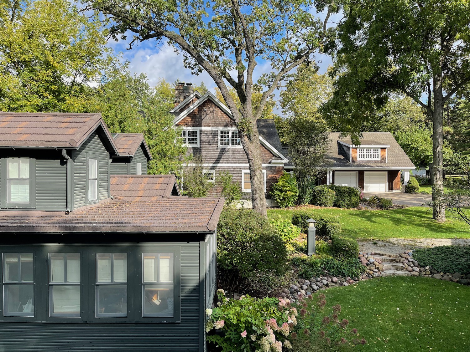 a house with a lawn and trees