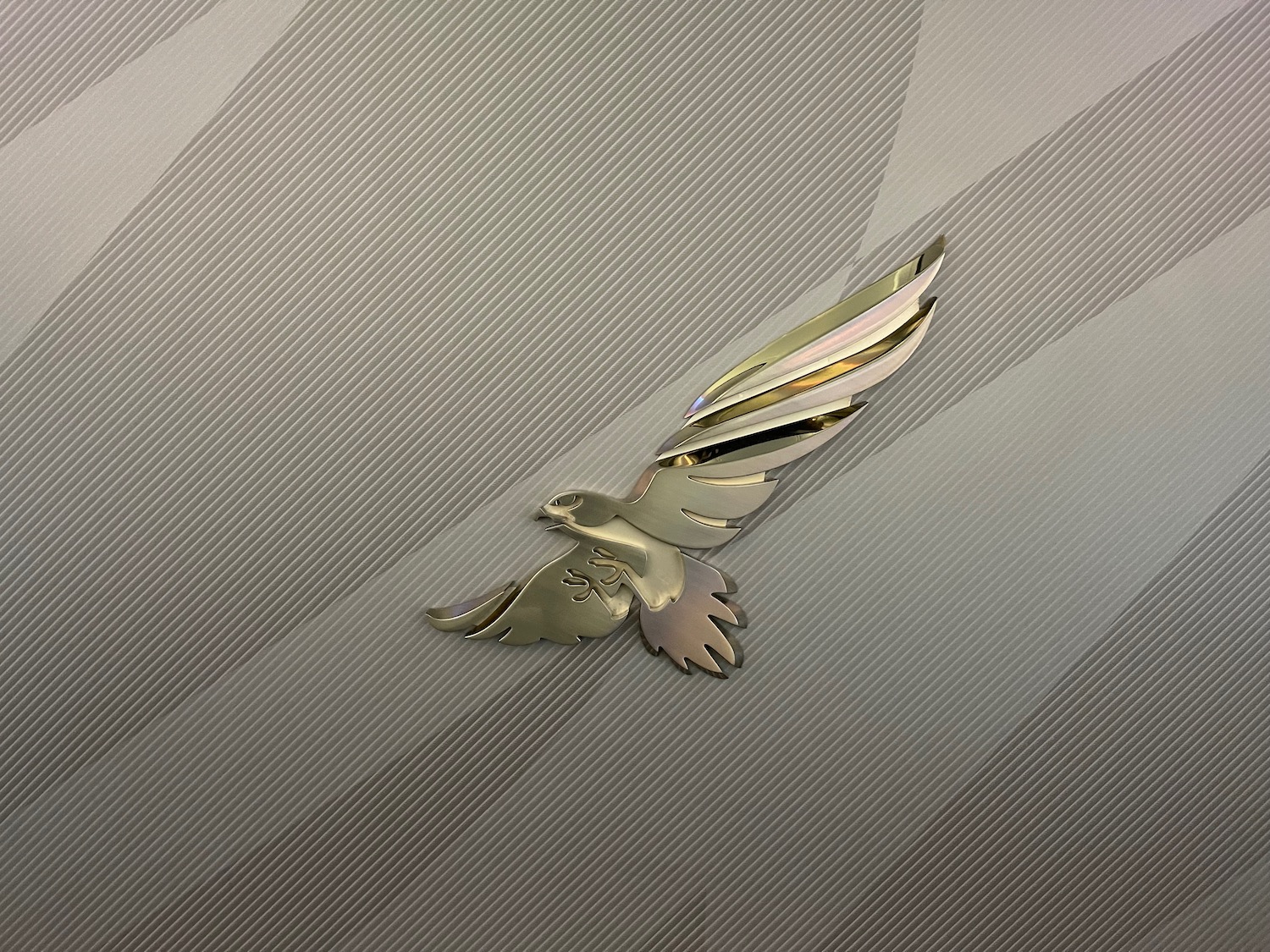a metal bird with wings