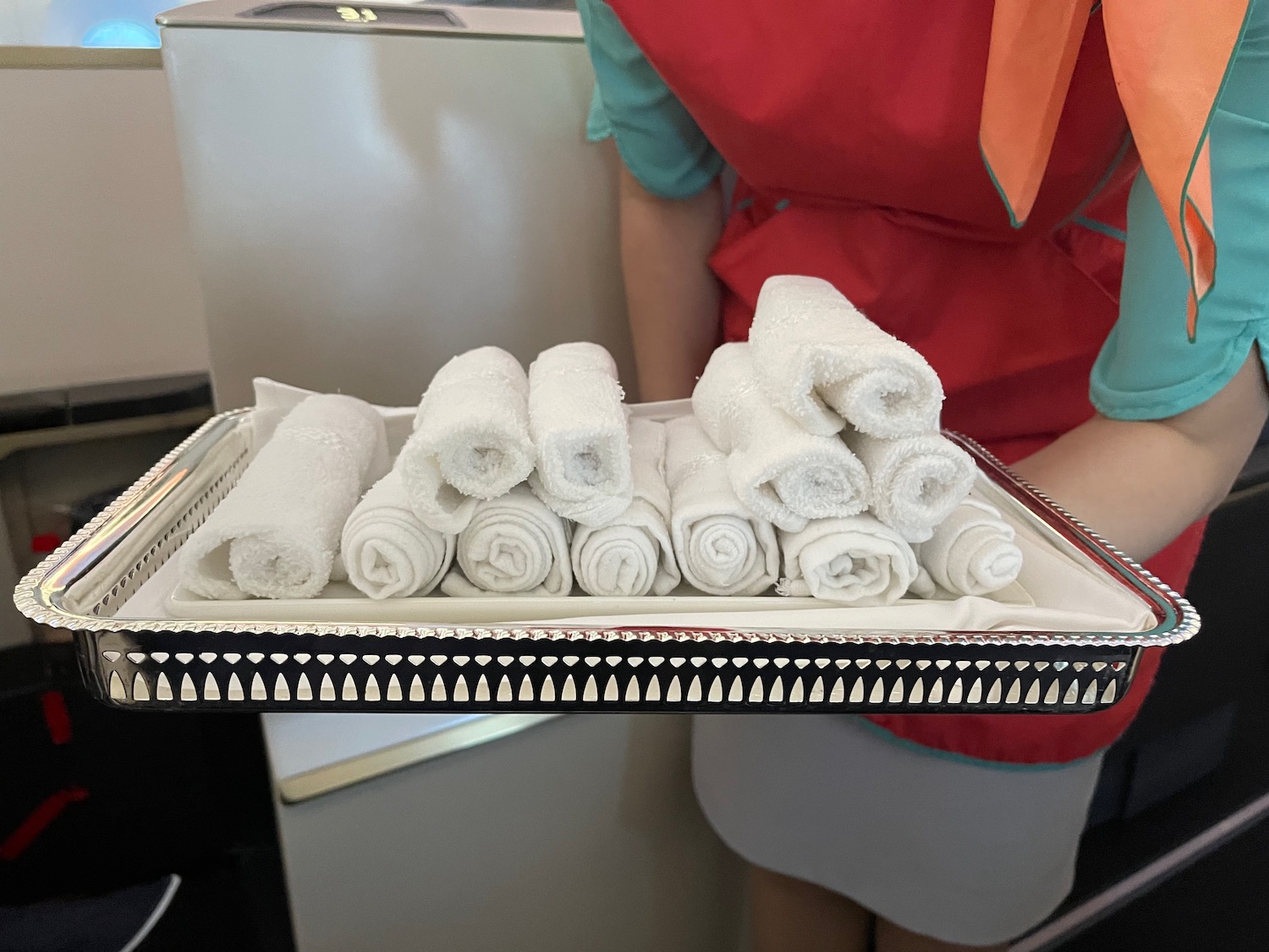 a tray of rolled up towels