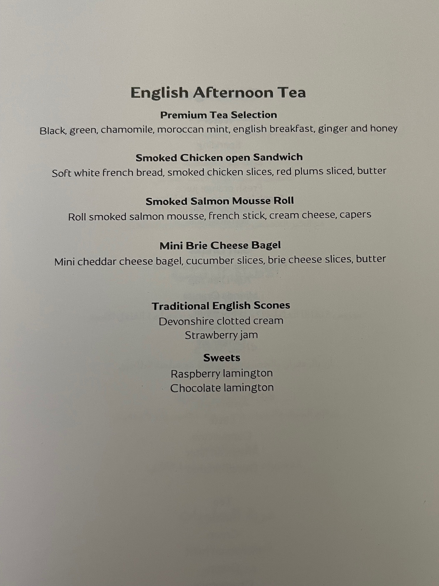 a menu of tea with black text