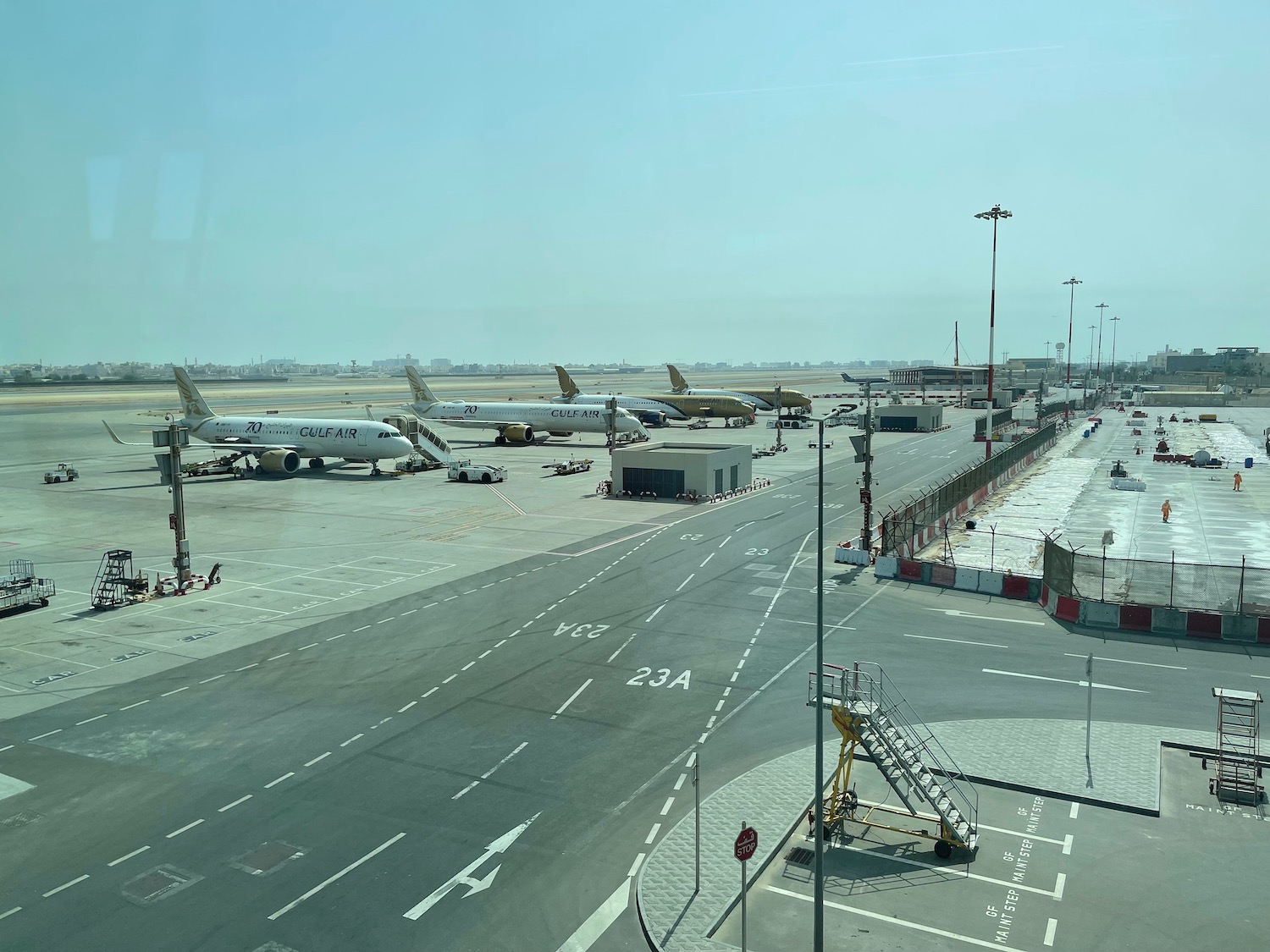 an airport with airplanes on the runway