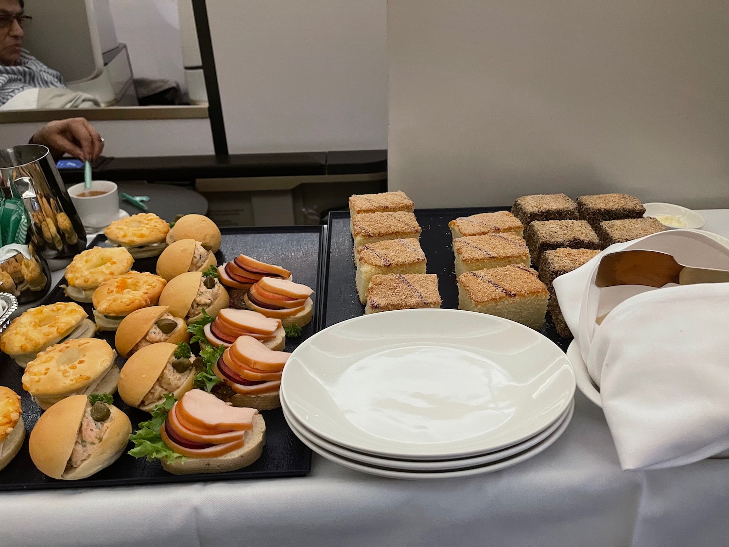 a table with plates and sandwiches