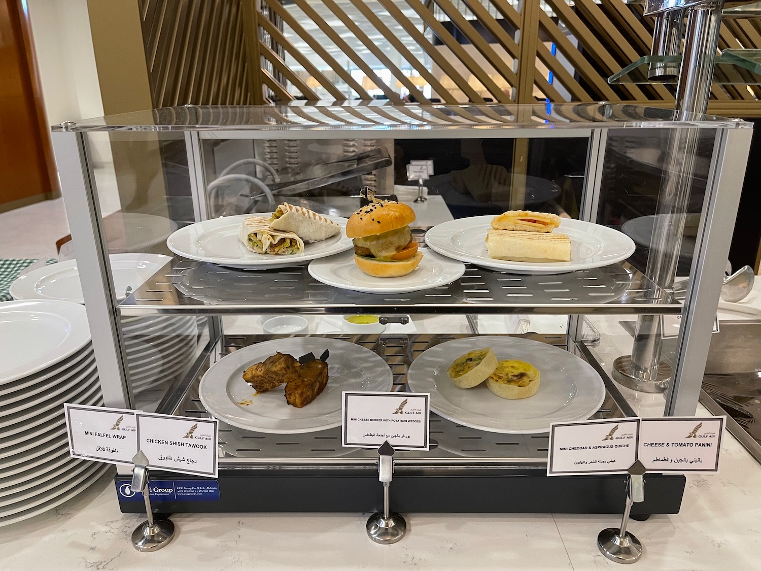 a display case with plates of food