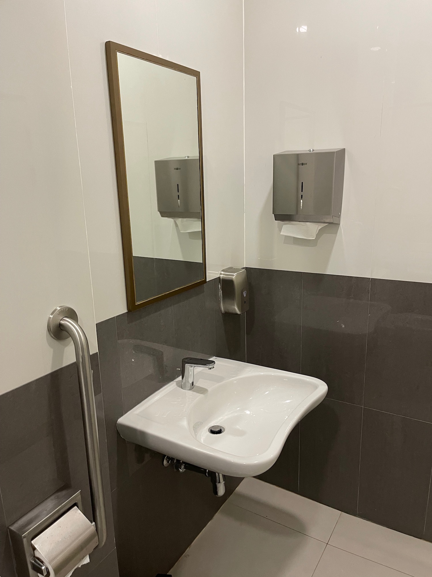 a sink and mirror in a bathroom