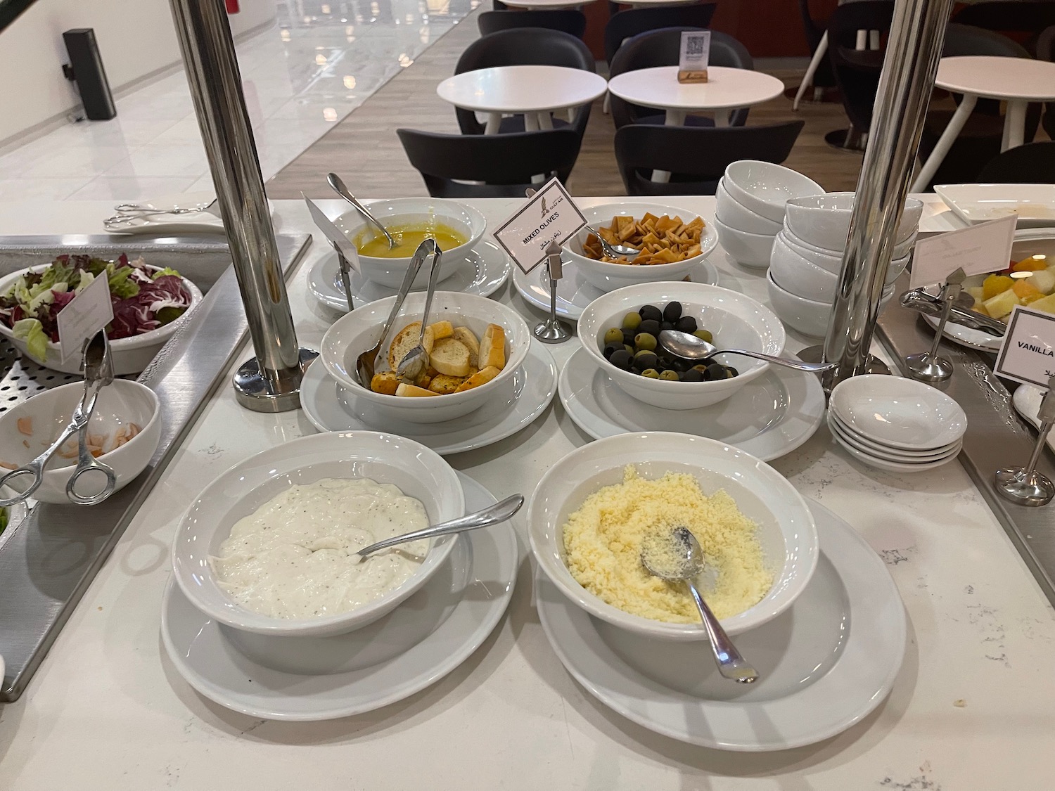 a buffet table with bowls of food