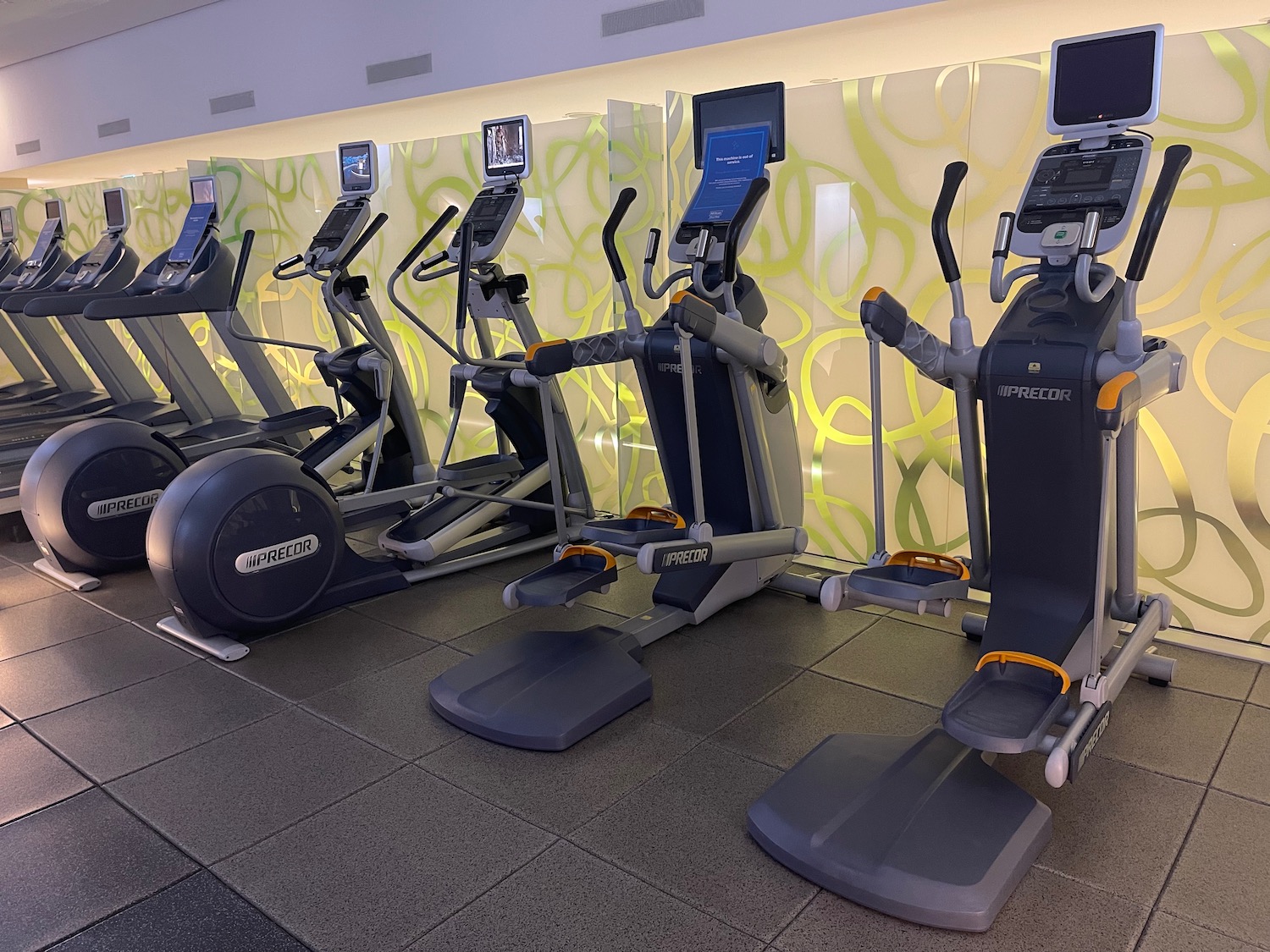 a group of exercise machines in a room