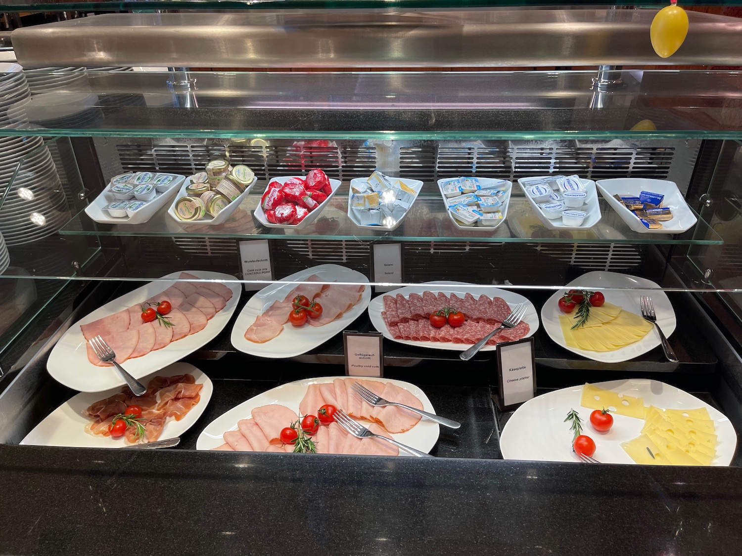 a display case with plates of food