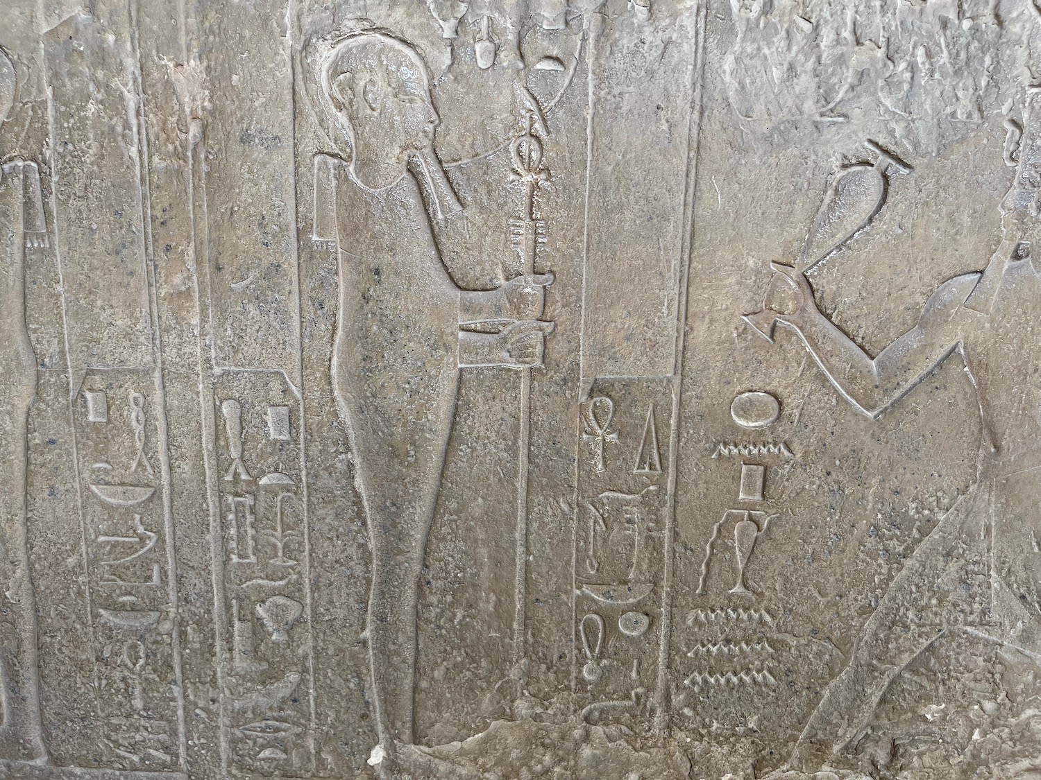 a stone wall with hieroglyphics