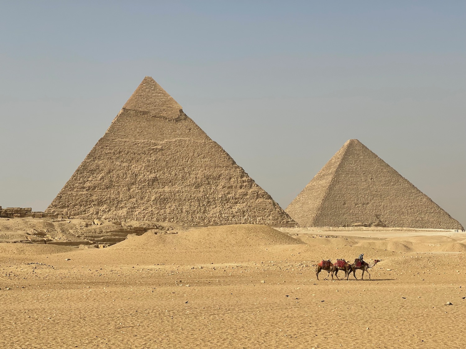 a group of pyramids in the desert