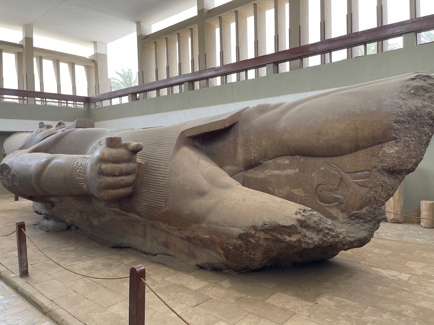 a large statue of a person lying down