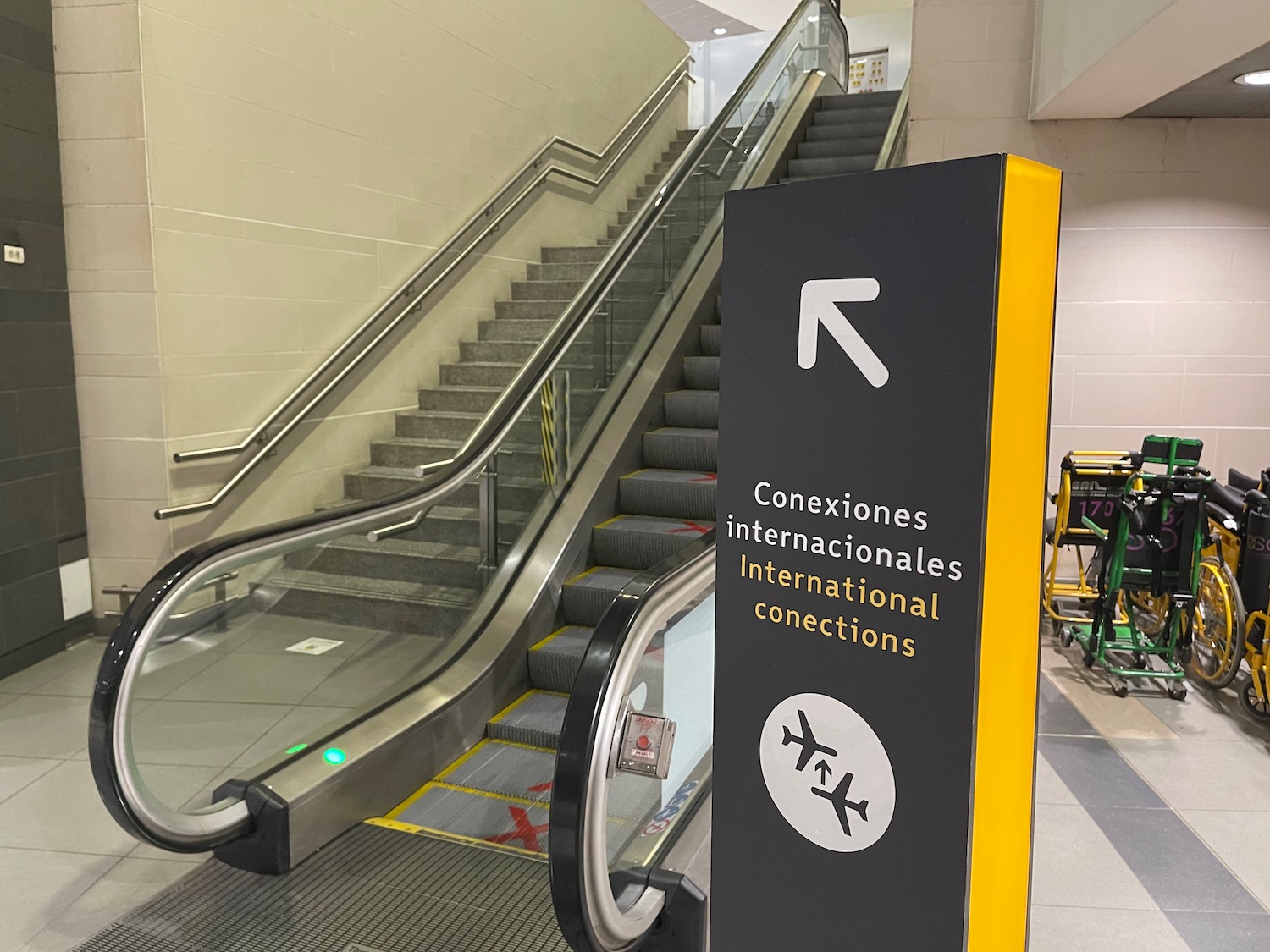 an escalator and a sign