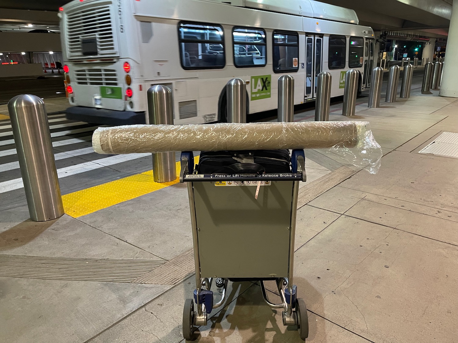 a trolley with a roll of carpet on it