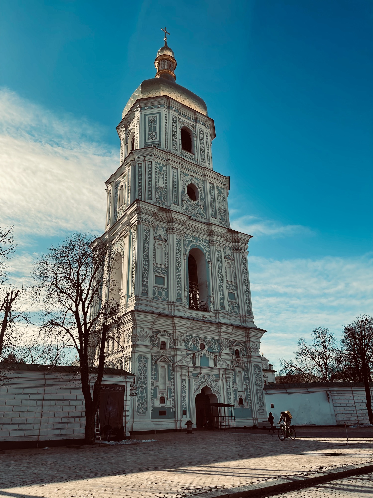 a tall white building with a gold dome