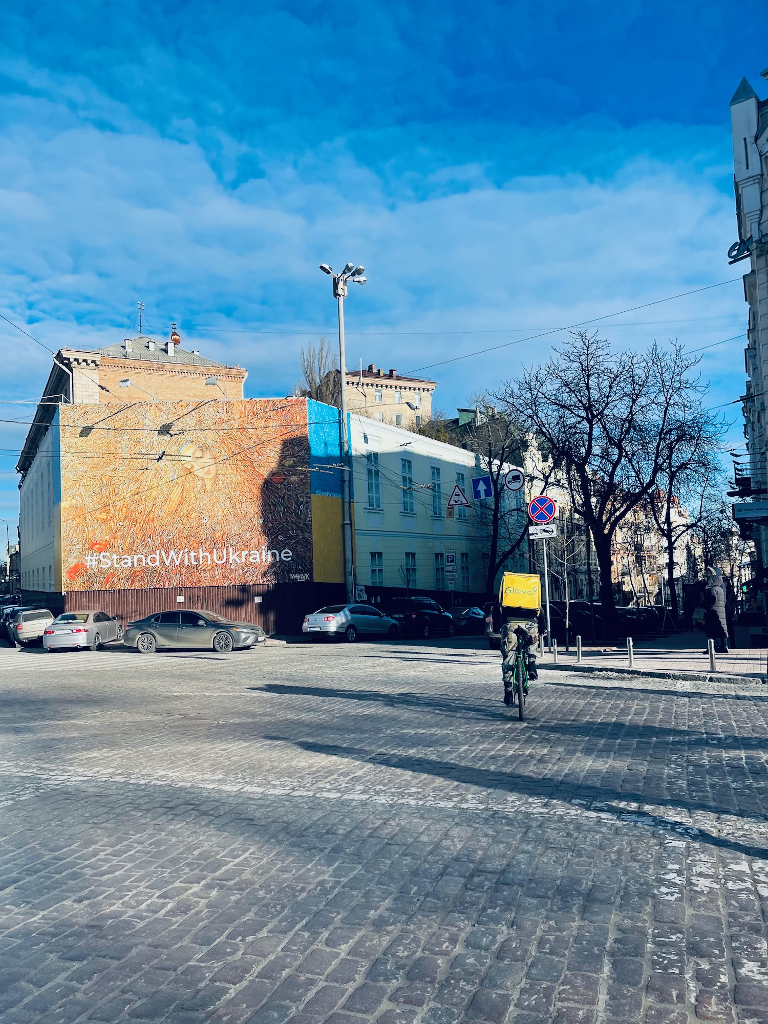 a person riding a bicycle in a city