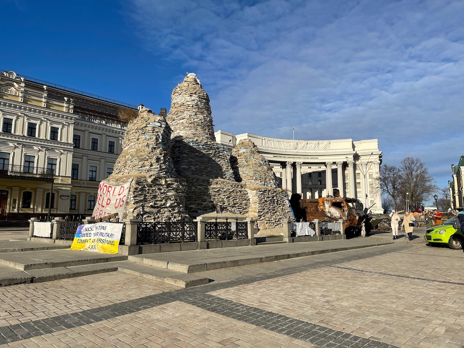 a stone structure with a sign in front of a building