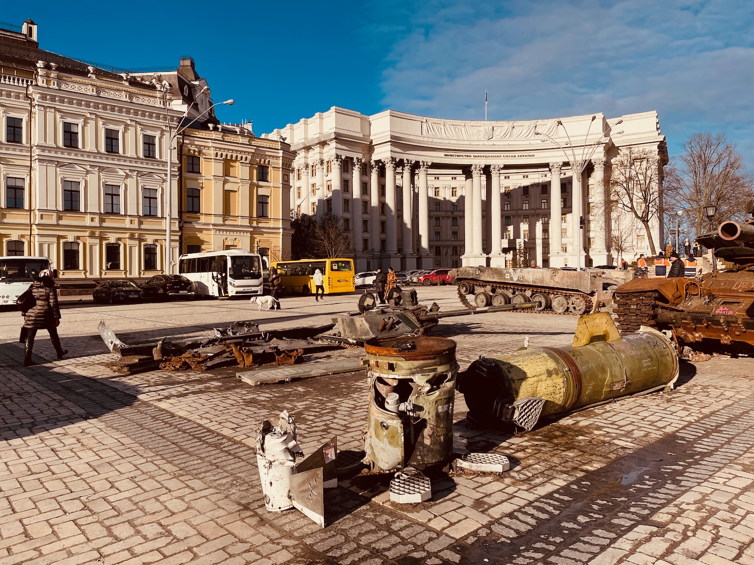 a large building with columns and a large round building with a large white building