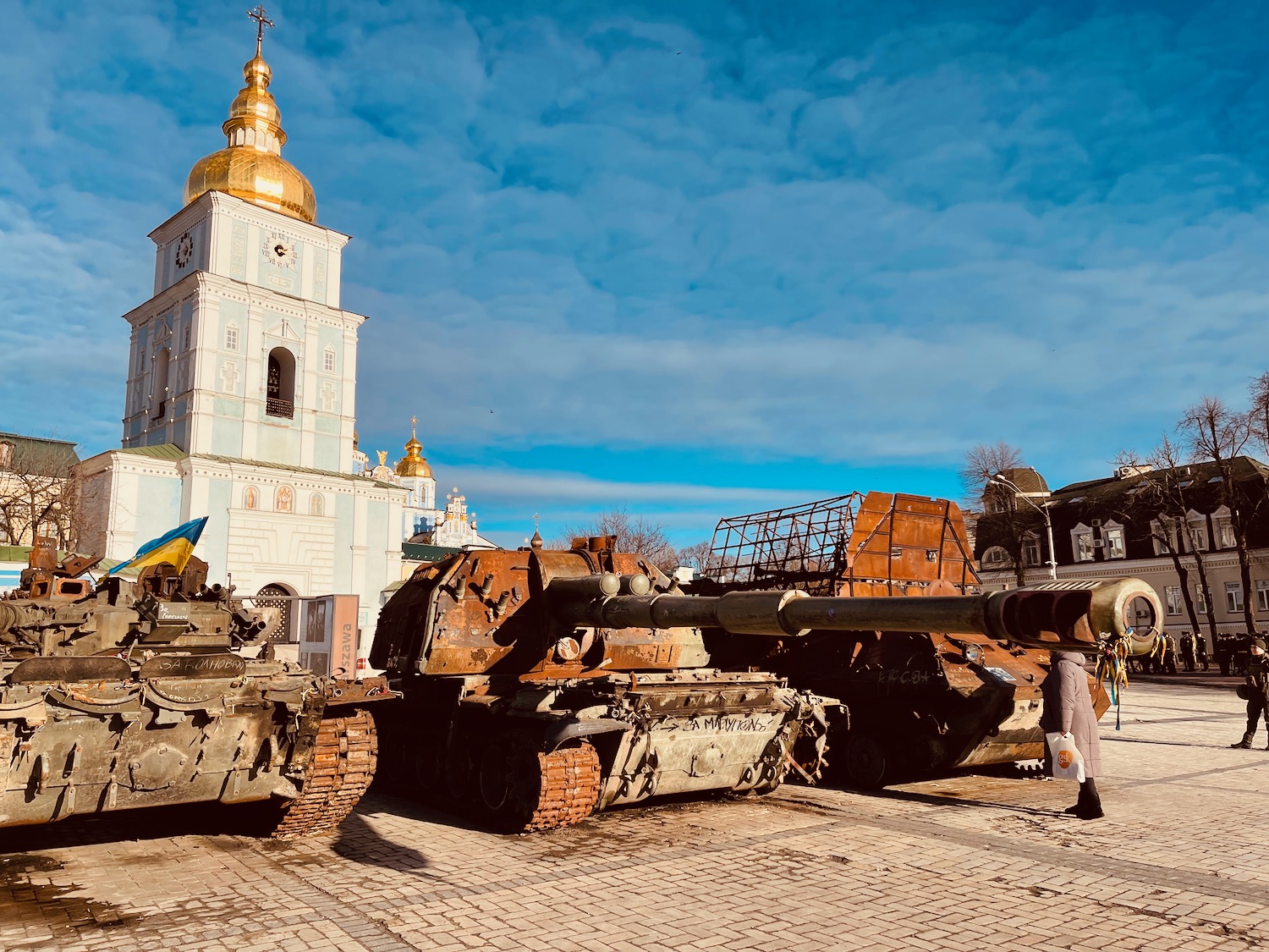 a group of tanks in front of a building