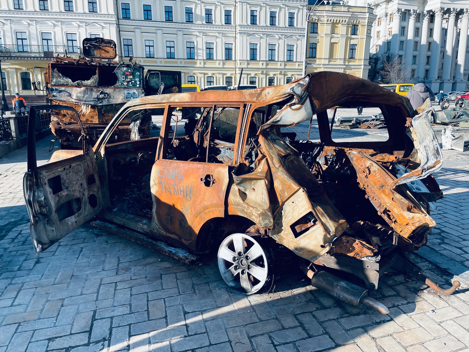 a rusty car with the doors open