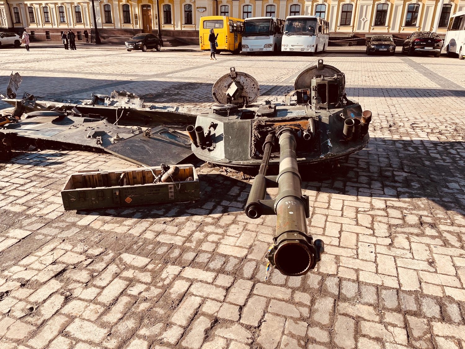 a military tank on a brick road
