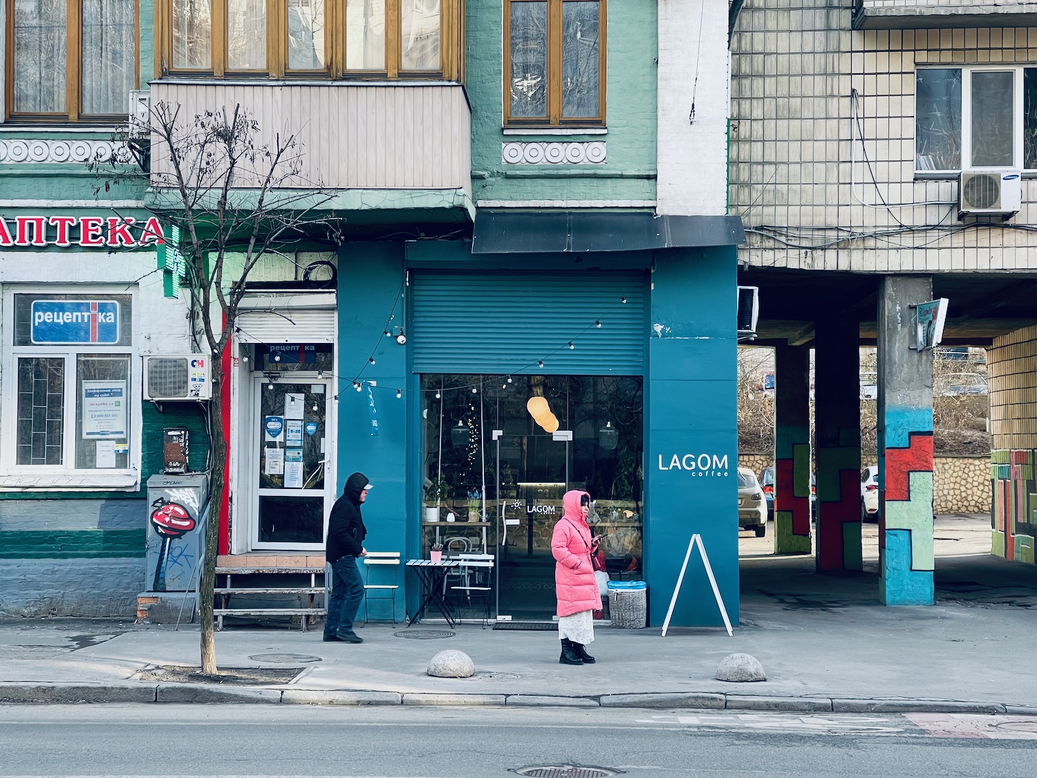 a group of people standing outside of a building