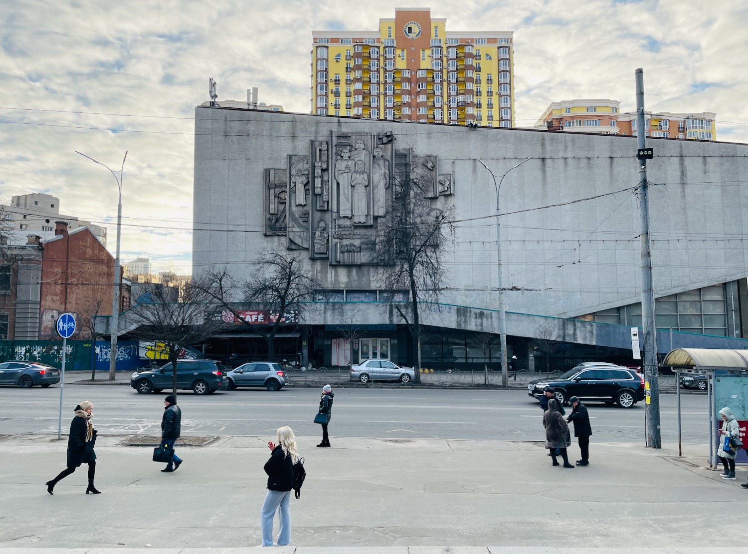 a group of people walking on a street