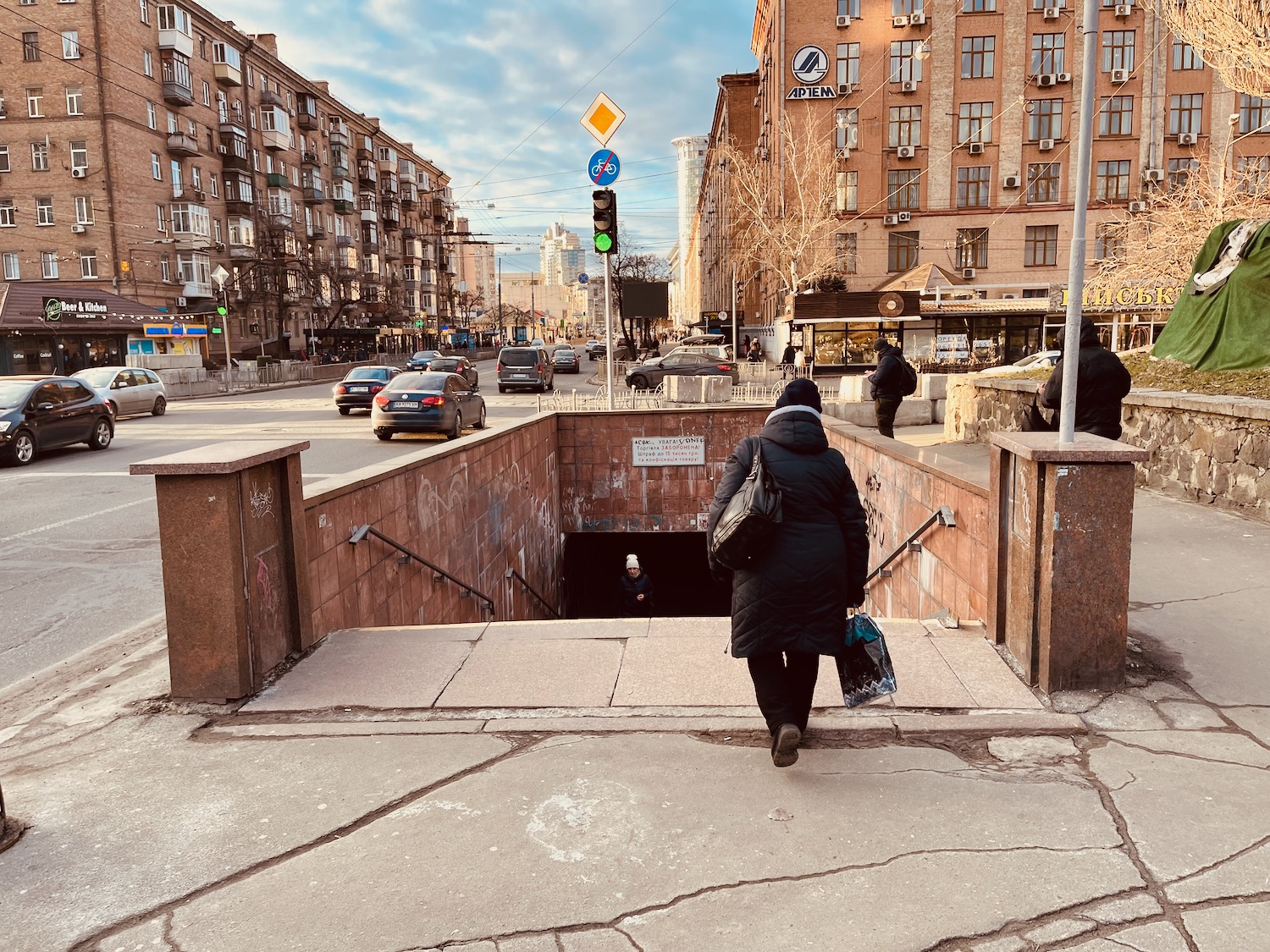 a person walking down a sidewalk