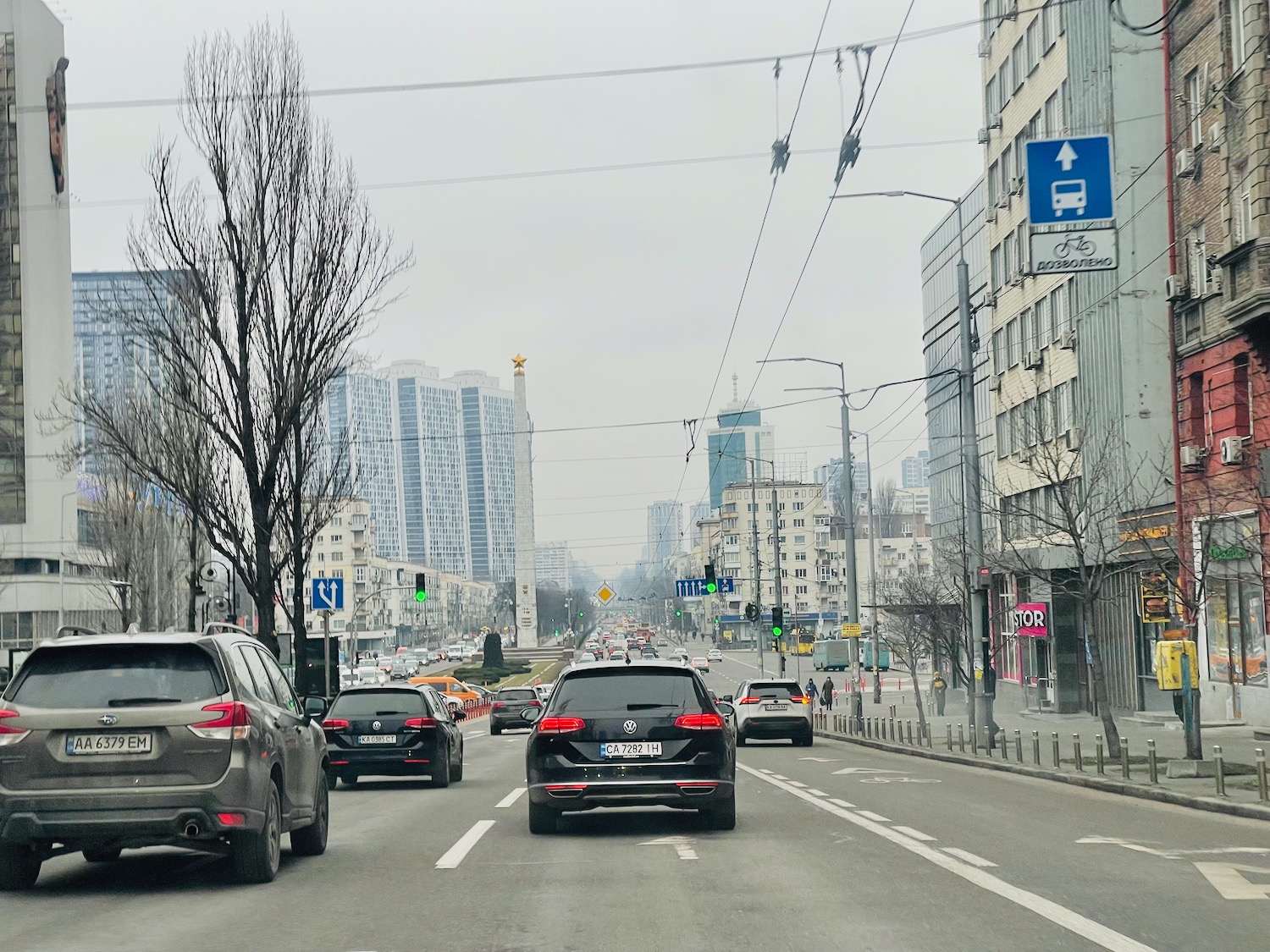 a street with cars and buildings