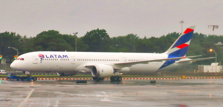 a large white airplane on a runway