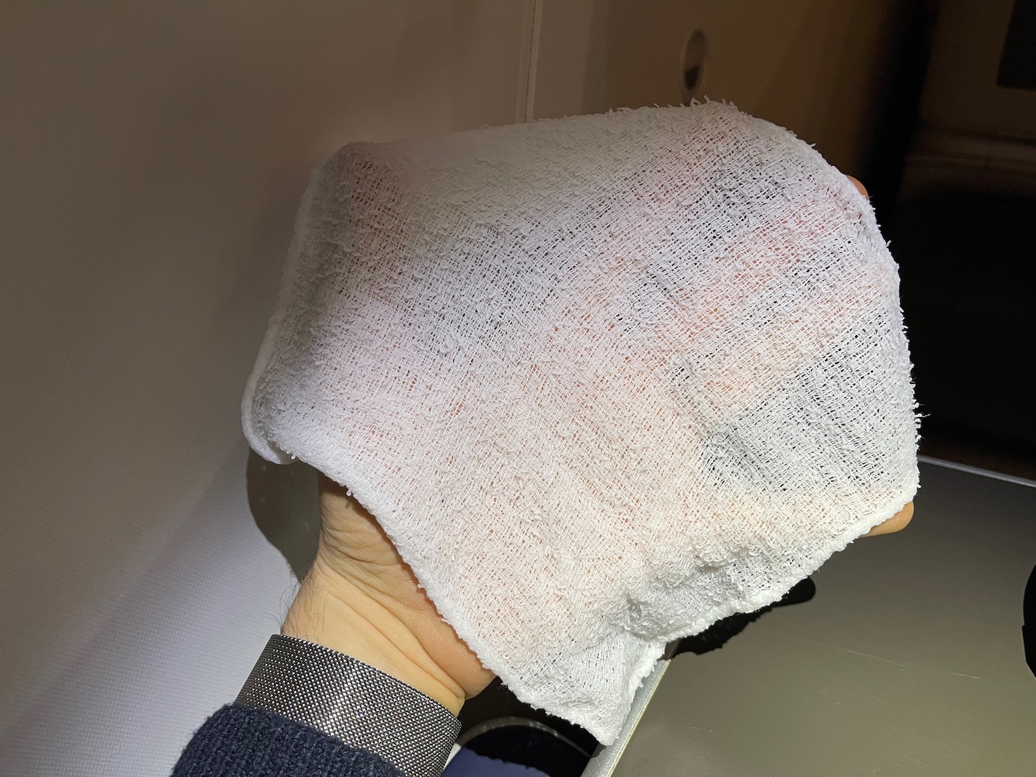 a person holding a white towel