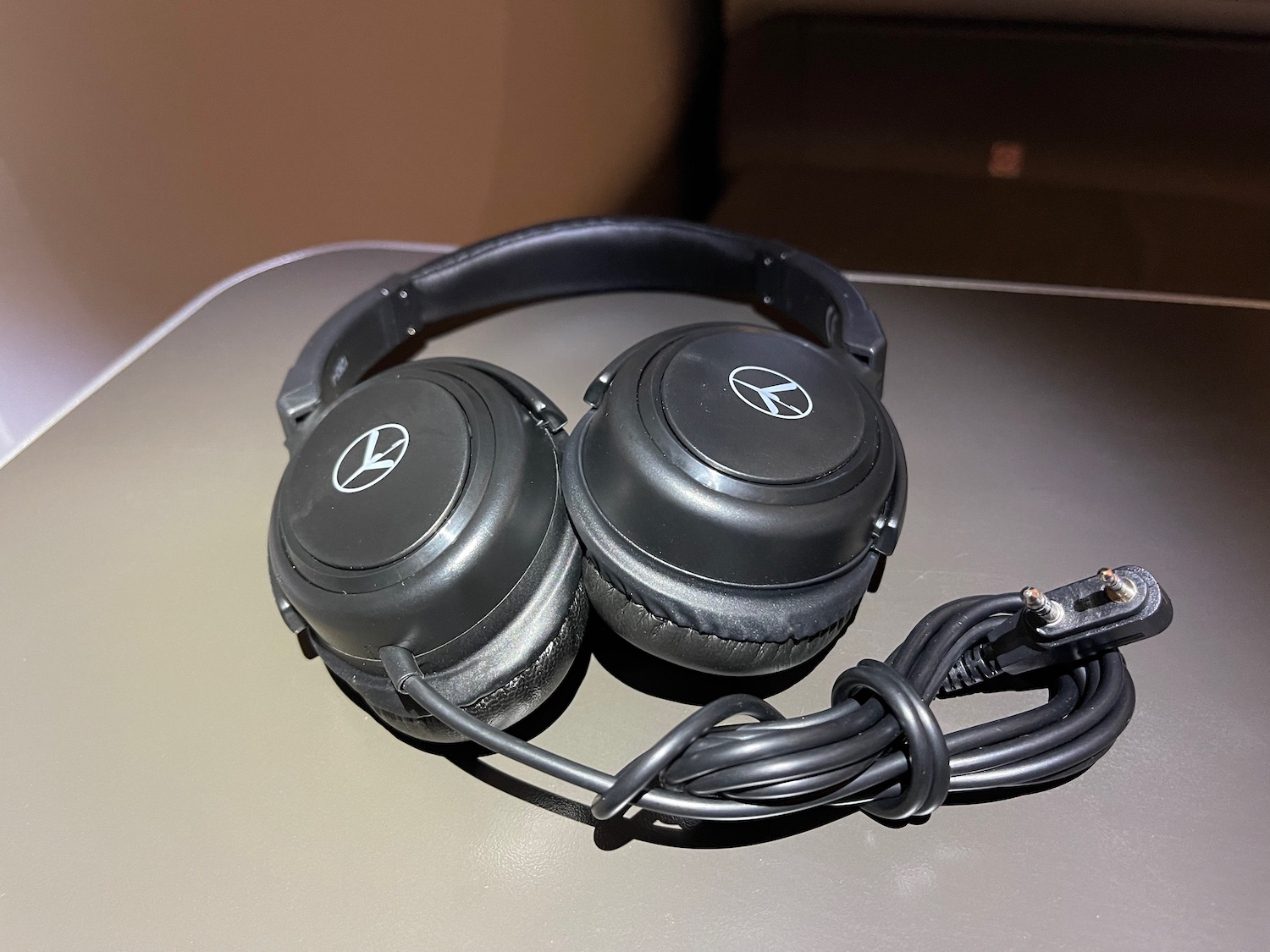 a pair of black headphones on a table