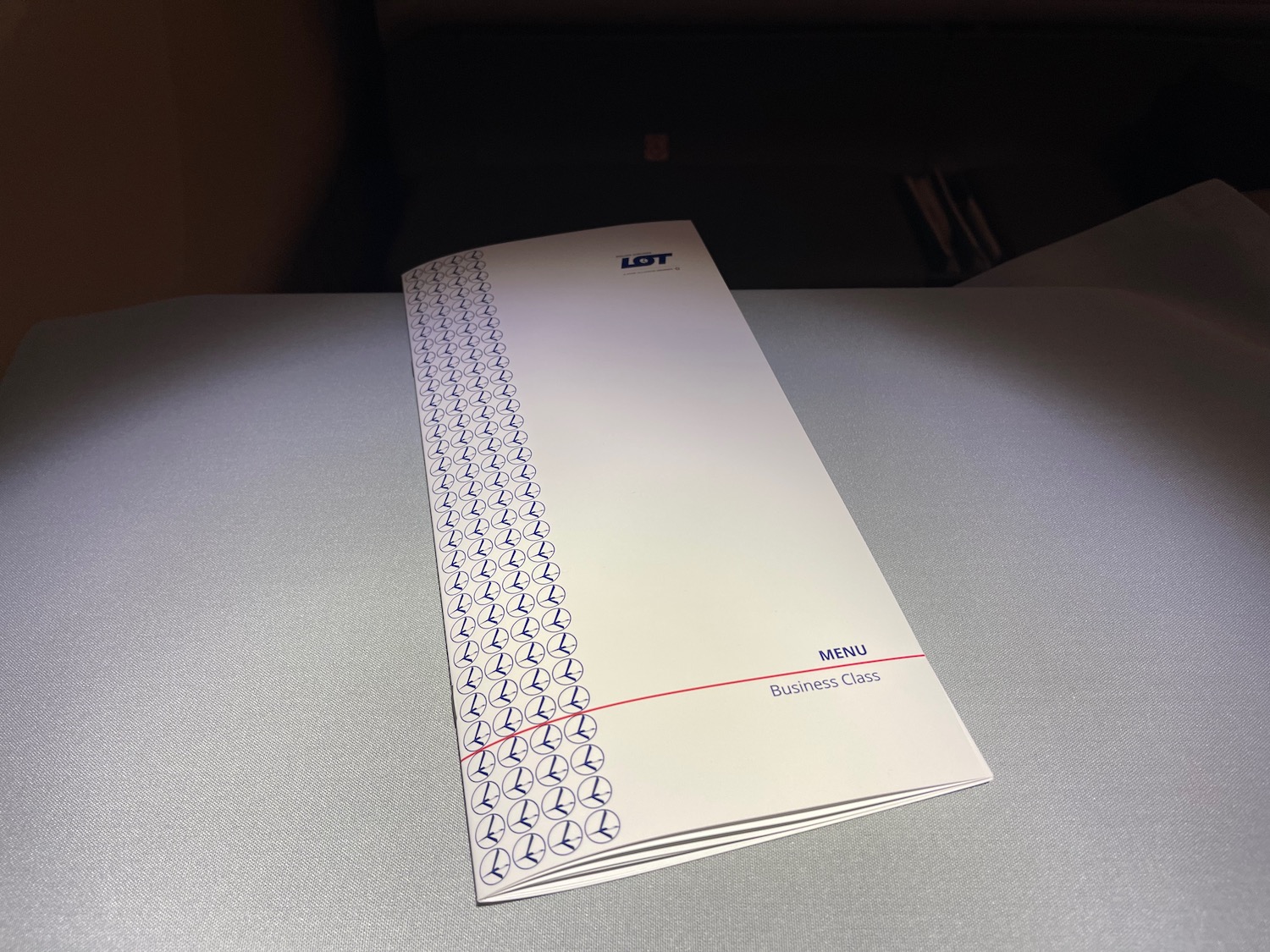 a white envelope with blue and red design