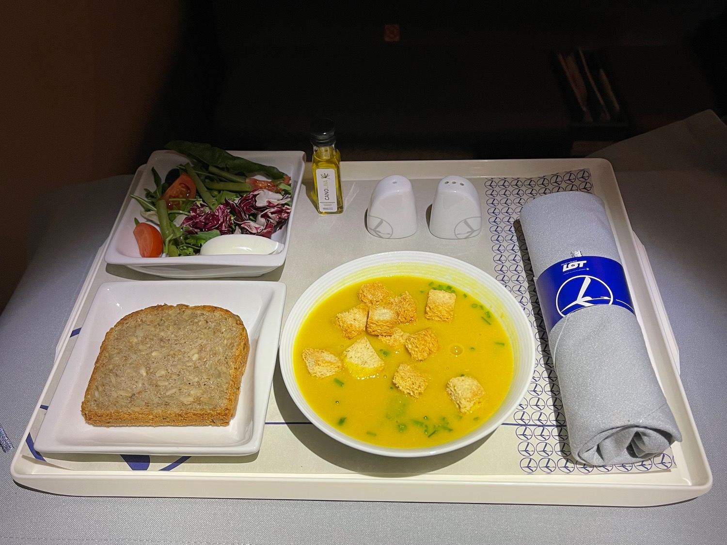 a tray with food and a bowl of soup on it