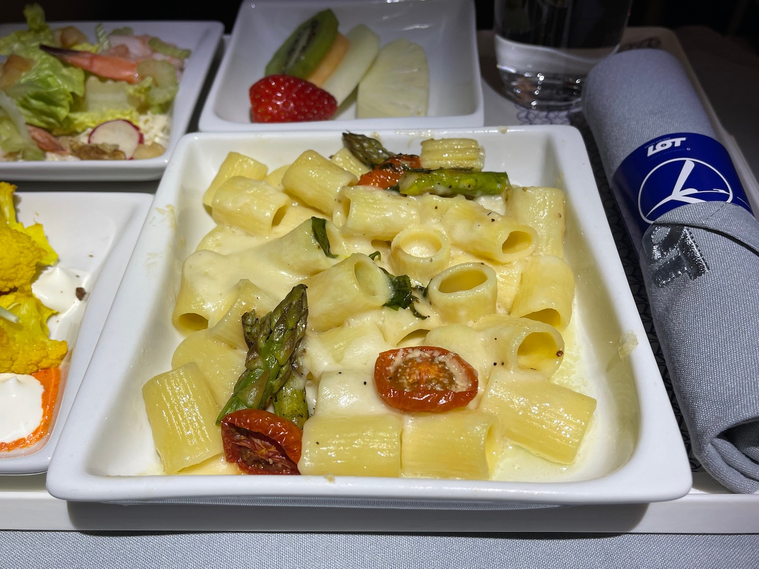 a plate of pasta with vegetables and cheese