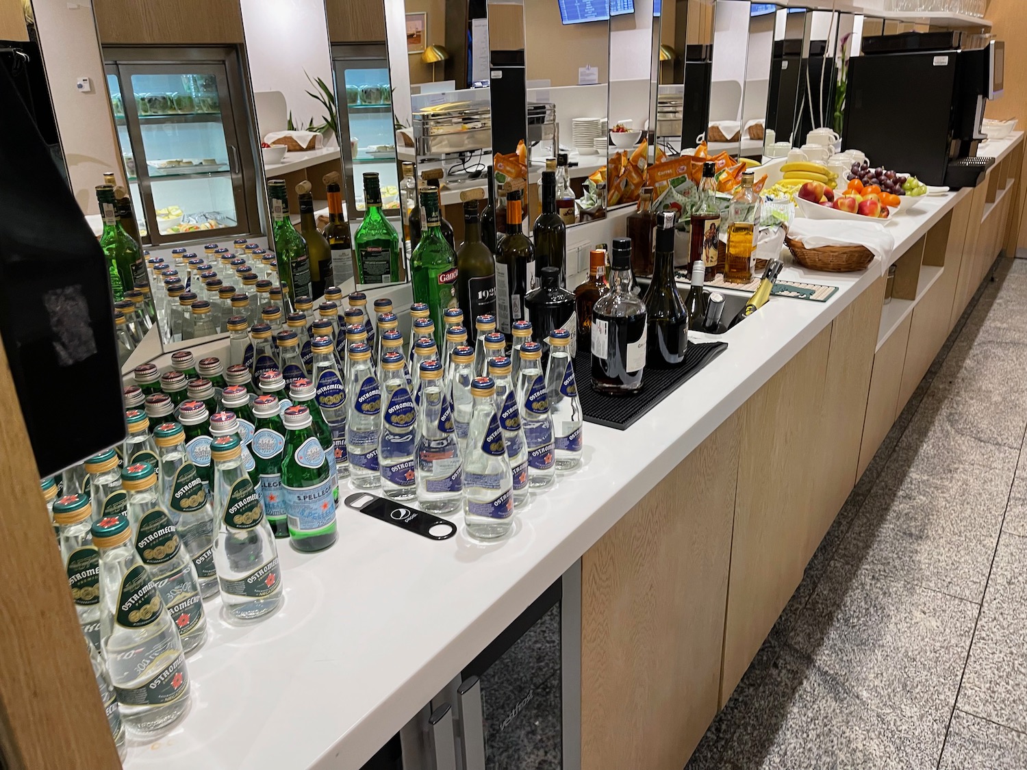 a table with bottles and bottles of liquid