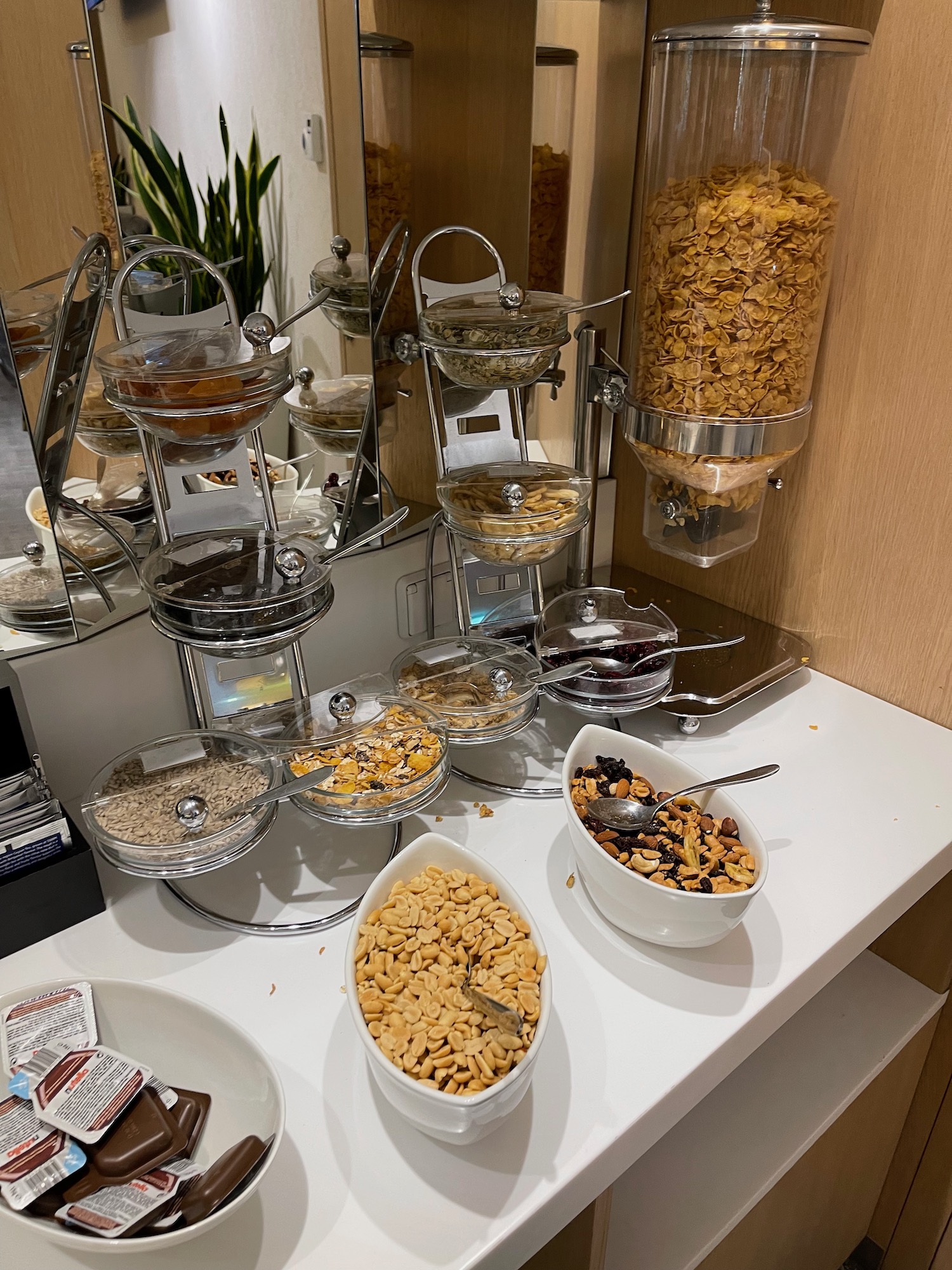 a breakfast buffet with cereal and cereal in bowls