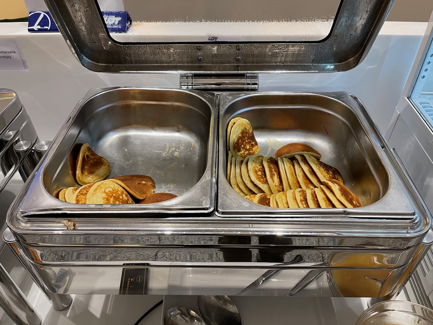 a pancake breakfast buffet with a lid open